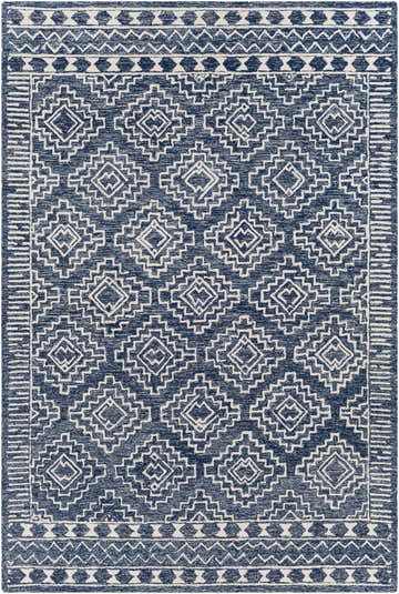 Close-up of the Horton Modern Wool Rug. Hand-tufted rug with a geometric pattern in navy and beige. Bohemian style. Design-Rectangle-69