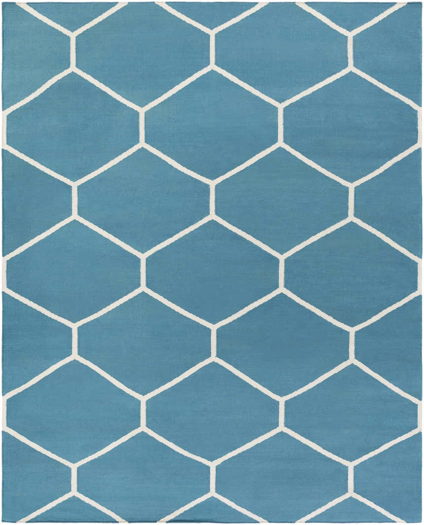 Close-up of the Hoskins Area Carpet. Denim blue cotton rug with an off-white geometric hexagon pattern. Design-Rectangle-810