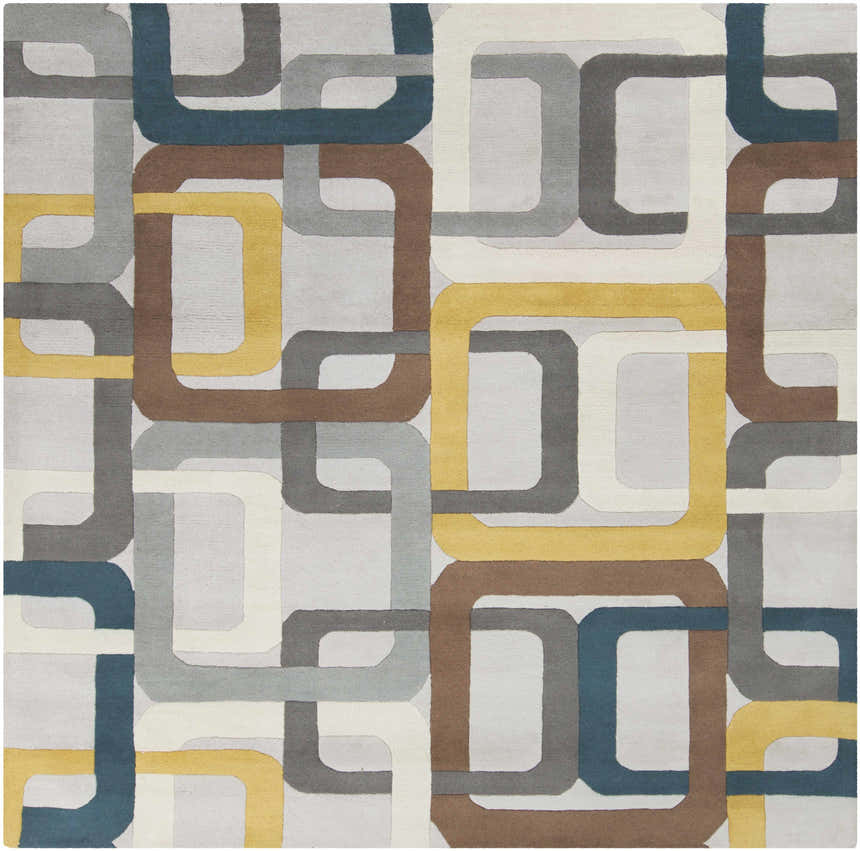 Close-up of the Harlech Area Rug featuring a geometric pattern in brown, dark blue, gray, ivory, and mustard tones. Design-Square-8