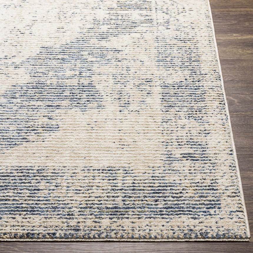 Close up of Herricks Denim Medallion Area Rug showing cream, denim, and beige colors on a dark wood floor. Front