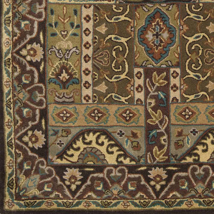 Close-up of the hand-tufted Huguenot 12x15 wool rug. Features a traditional floral pattern with beige, brown, olive, and teal accents. Swatch