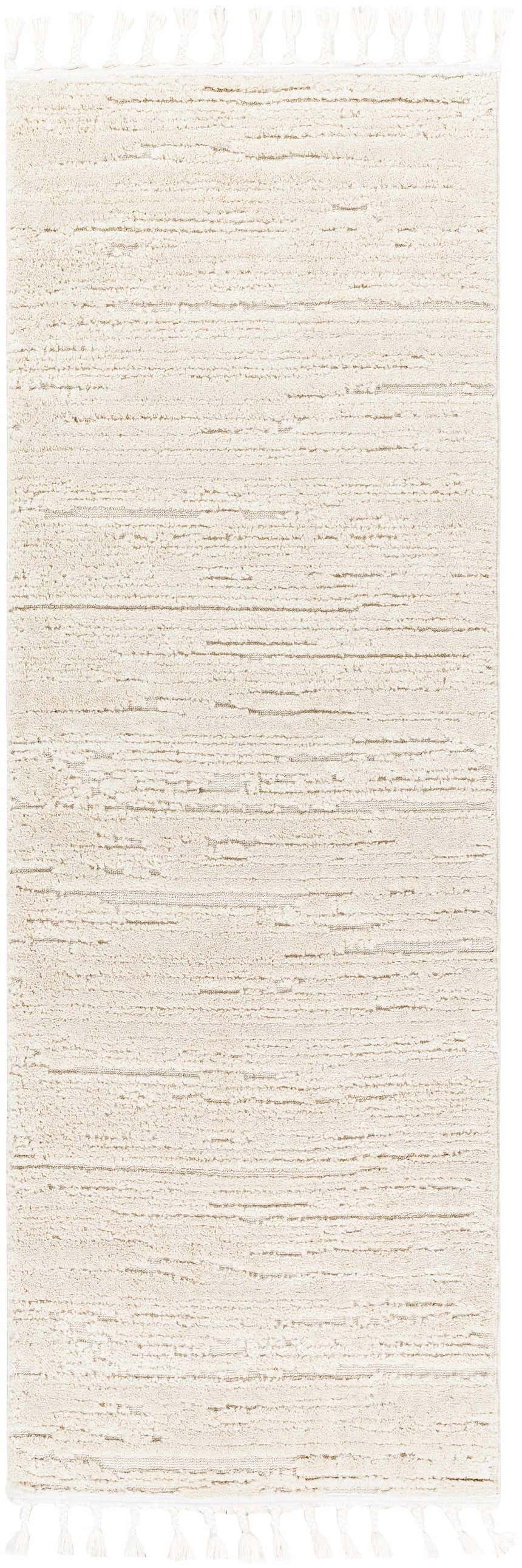 Close-up of the Ibarra Textured Ivory High/Low Pile Rug with Tassels, showing its textured weave and tassel details. Design-Runner-268