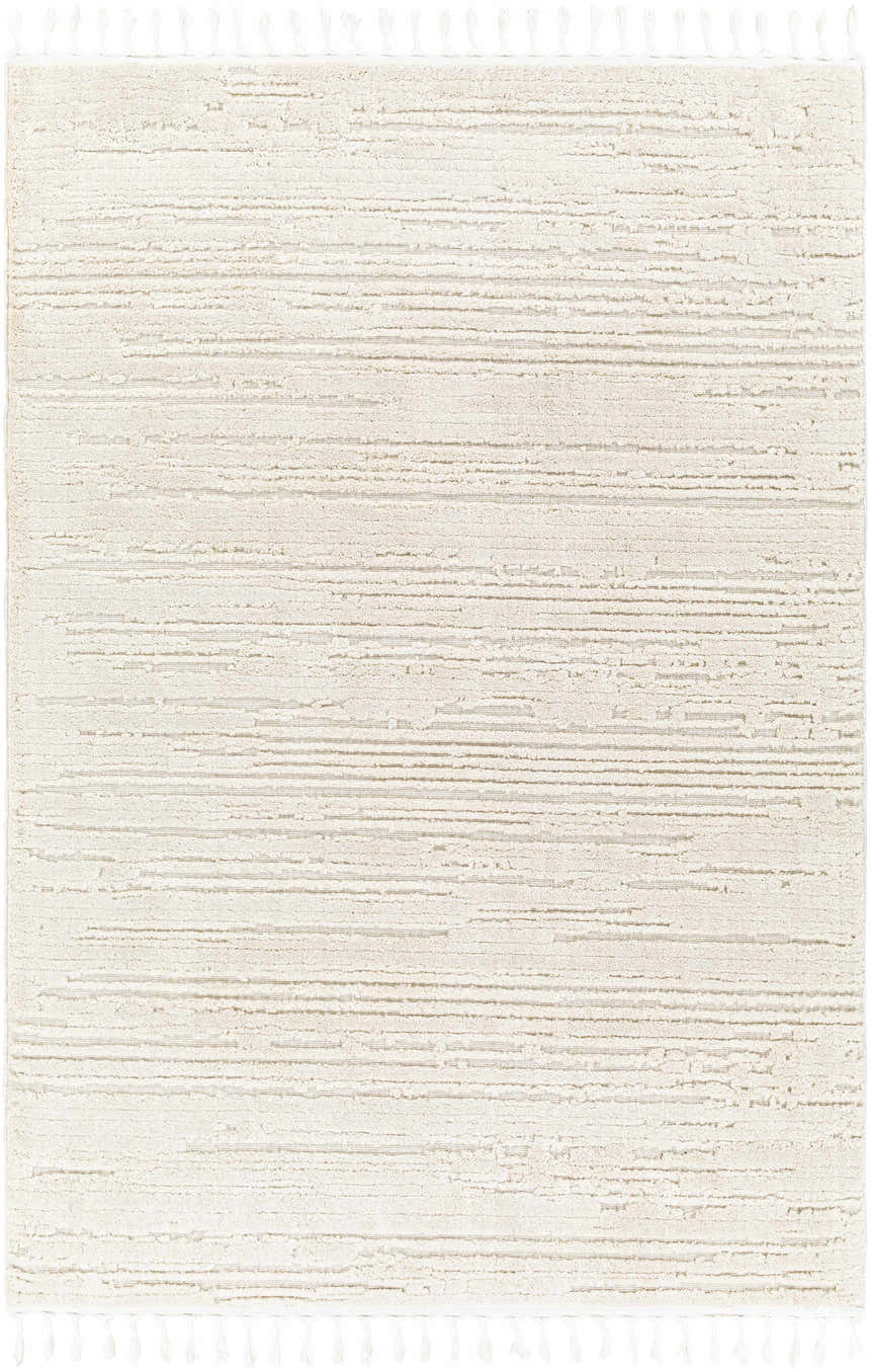 Close-up of the Ibarra Textured Ivory Rug, featuring a high/low pile design and tassel details. Design-Rectangle-537