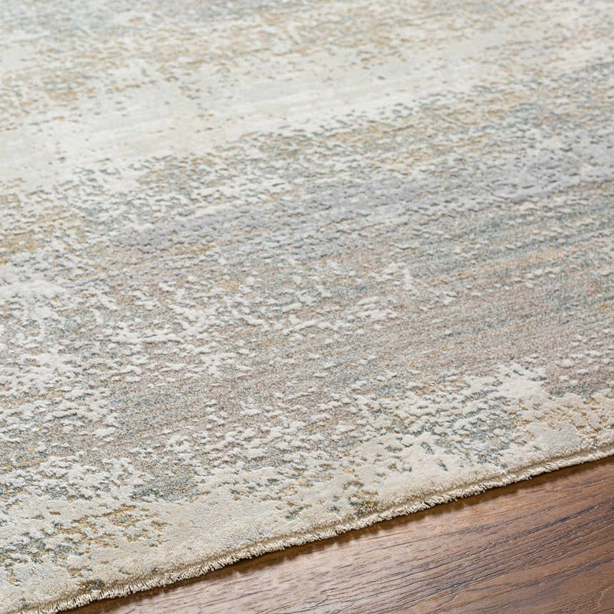 Close-up of the Ikram Thick Luxe Boutique Rug showing its gray tones, abstract pattern, and soft, textured pile. Texture