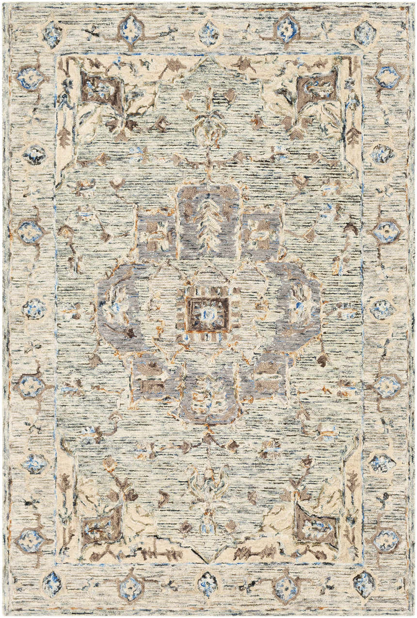 Detailed view of the Ivyton Hand Tufted Wool Carpet, featuring a traditional pattern in light beige, blue, and brown tones. Design-Rectangle-576