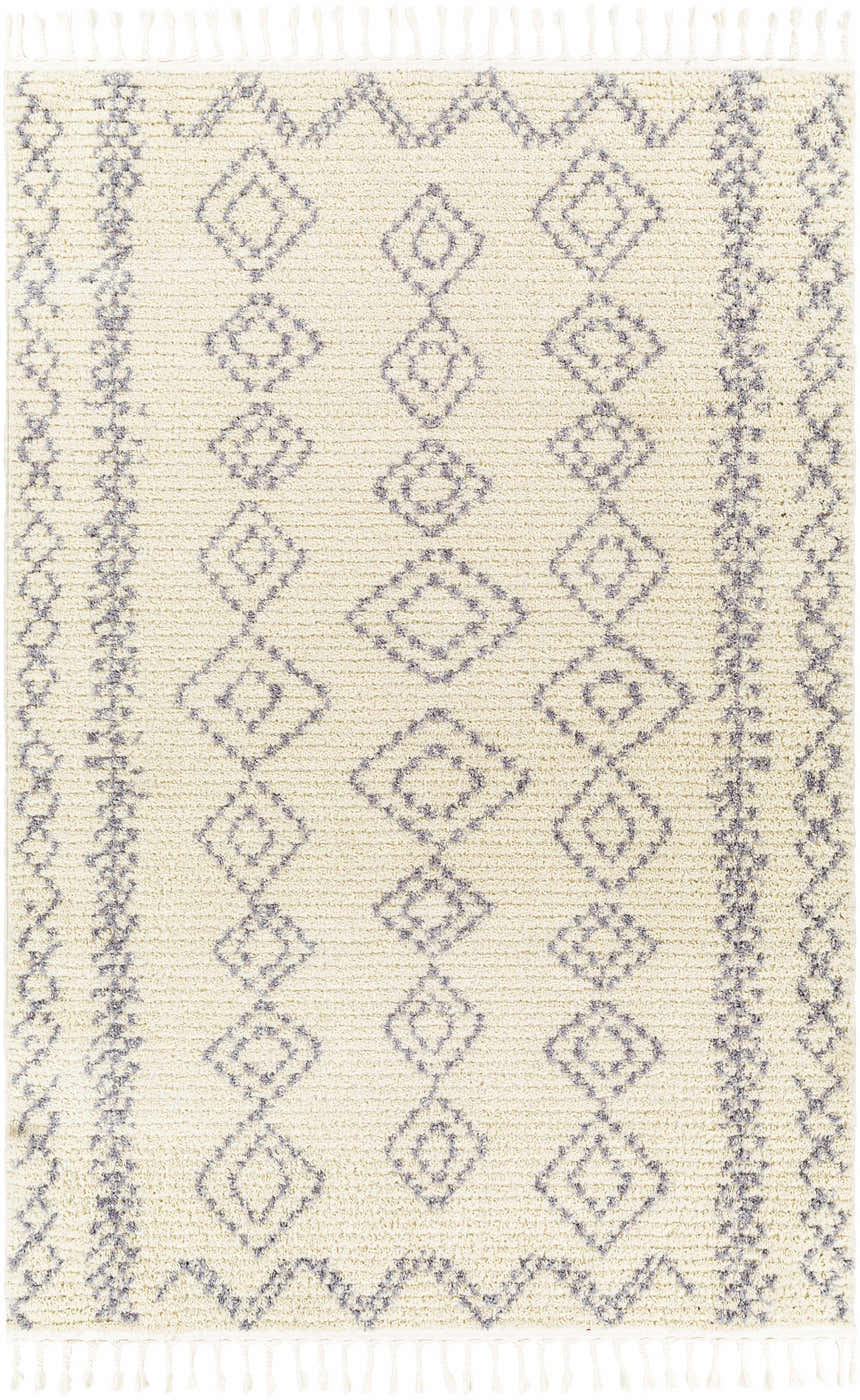 Close-up of Jabonga Area Rug. Cream rug with gray diamond pattern and tassels. Farmhouse style. Design-Rectangle-537