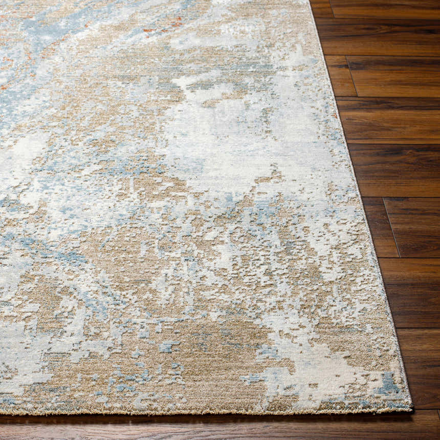 Close up of Jaela Thick Luxe Area Rug showing brown, light blue, and cream abstract pattern and plush texture. Front