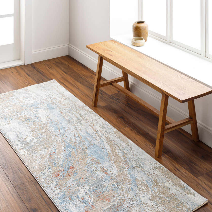 Entryway with Jaela Thick Luxe Area Rug runner in brown, blue, and gray. Wooden bench by window on dark wood floor. Roomscene-Runner