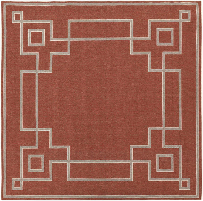 Close-up of the brick red Jarrell Area Rug featuring a light beige geometric border pattern. Design-Square-89