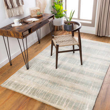 Home office with wood desk, chair, plants, and Kalaheo Premium Rug in sage. Contemporary style. Roomscene-Rectangle