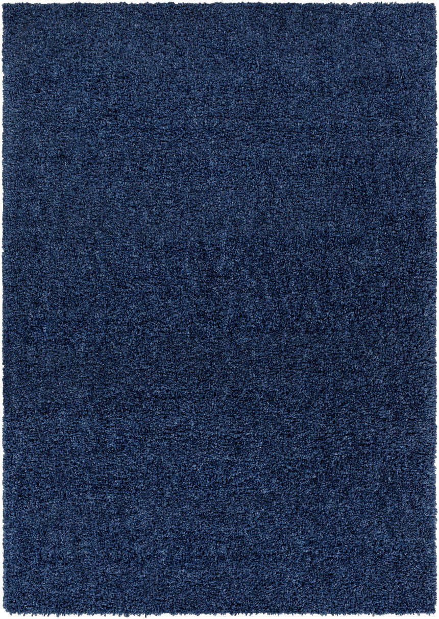 Close-up of the plush, navy blue Kampokpok Area Rug. Shag style adds texture and comfort. Design-Rectangle-5373