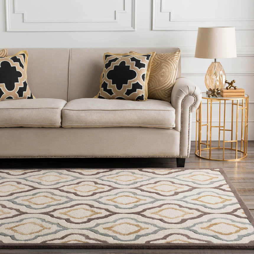 Living room scene with a Karval Clearance Rug, beige sofa, gold accents, and a contemporary farmhouse style. Roomscene-Rectangle
