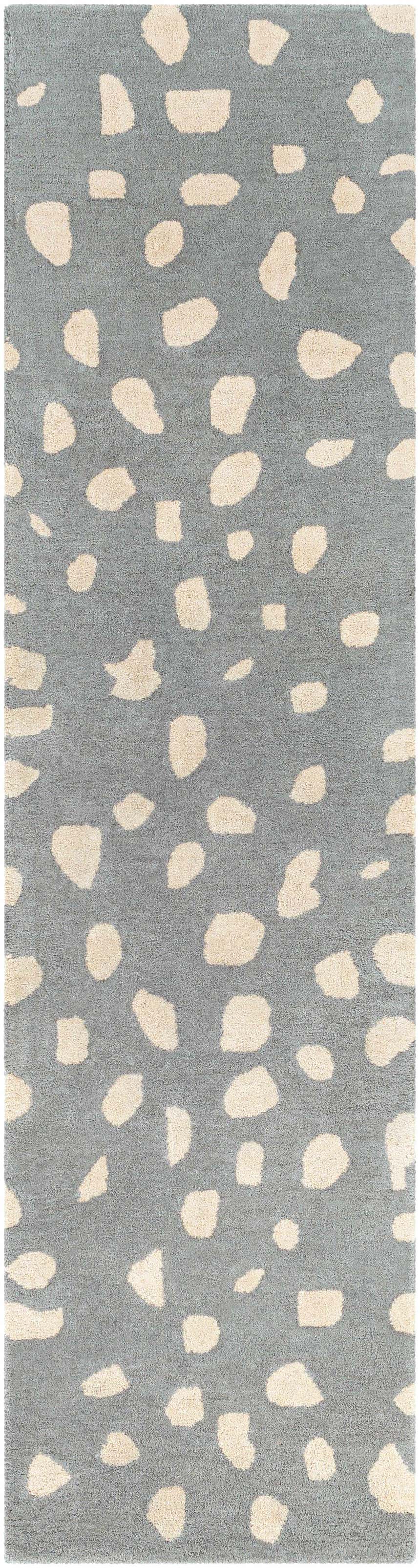 Close-up of the Kaweah Dalmatian Print Carpet. Hand-tufted rug in gray with a cream-colored animal pattern. Contemporary style. Design-Runner-28