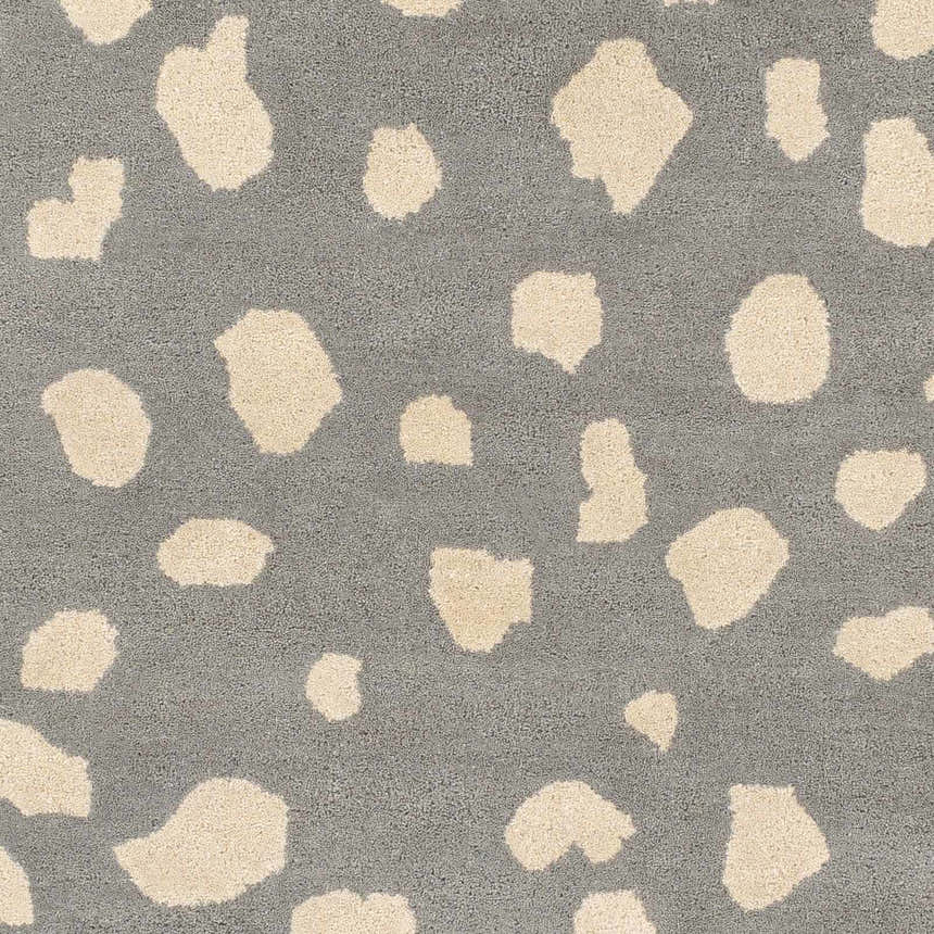 Close-up of the Kaweah Dalmatian Print Carpet, featuring a gray background with cream-colored animal spots. Swatch