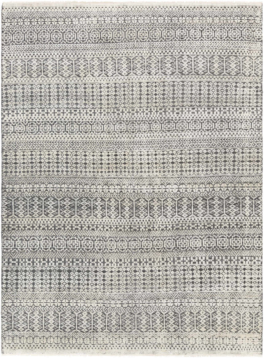 Close-up of the Kiara Area Rug showcasing its black, charcoal, and oatmeal bohemian-inspired geometric pattern. Design-Rectangle-69