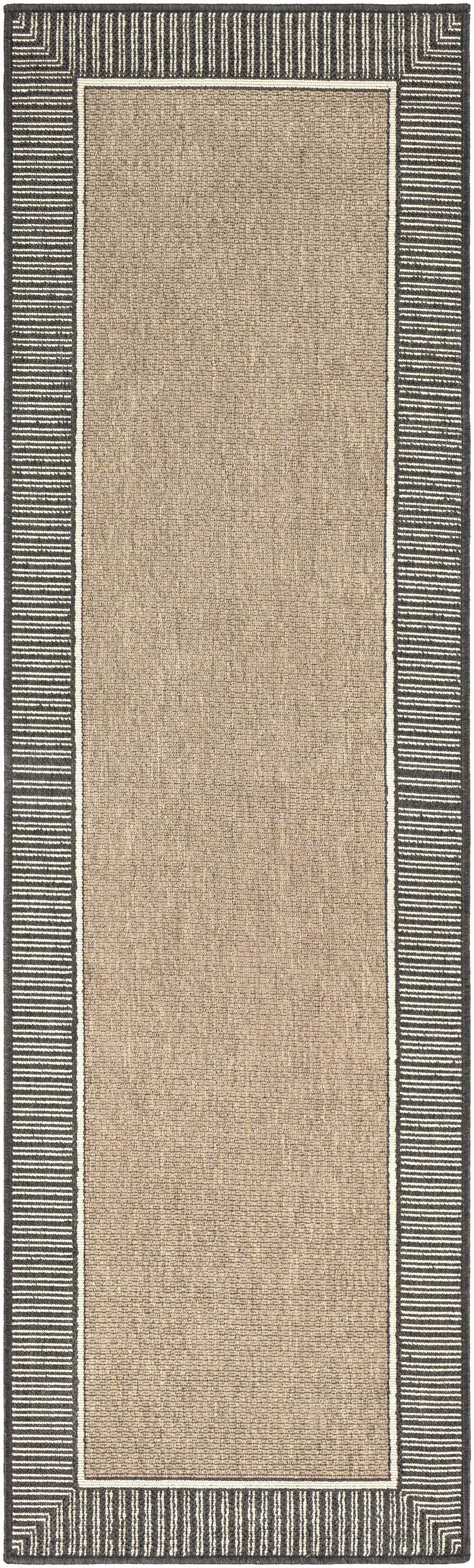 Close-up of the Kidron Area Rug, a beige rug with a black and white striped border. Contemporary style. Design-Runner-2379