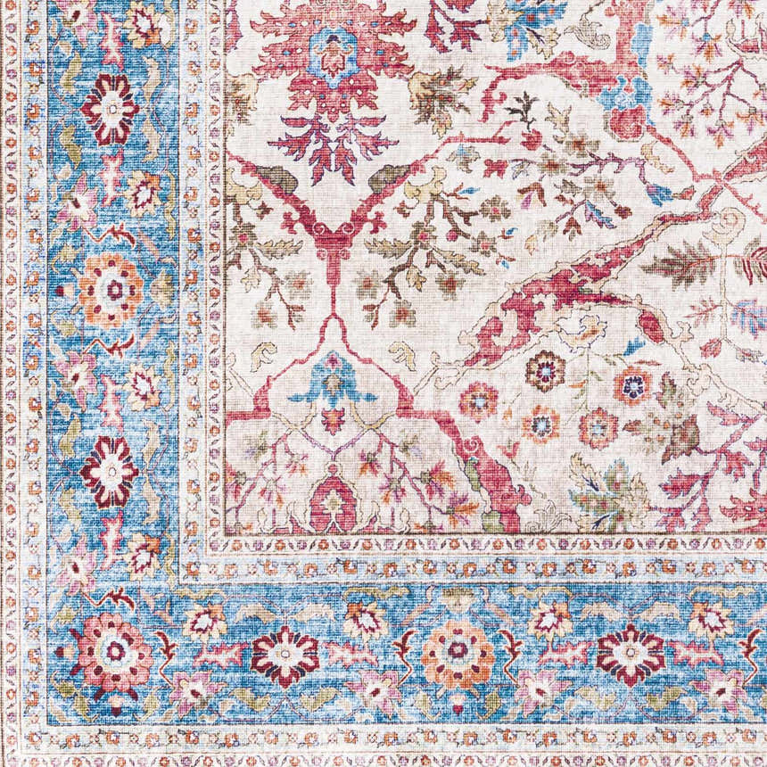 Close-up of the Kislingbury Area Rug. Farmhouse style rug in beige, blue, burnt orange, and red floral pattern. Swatch