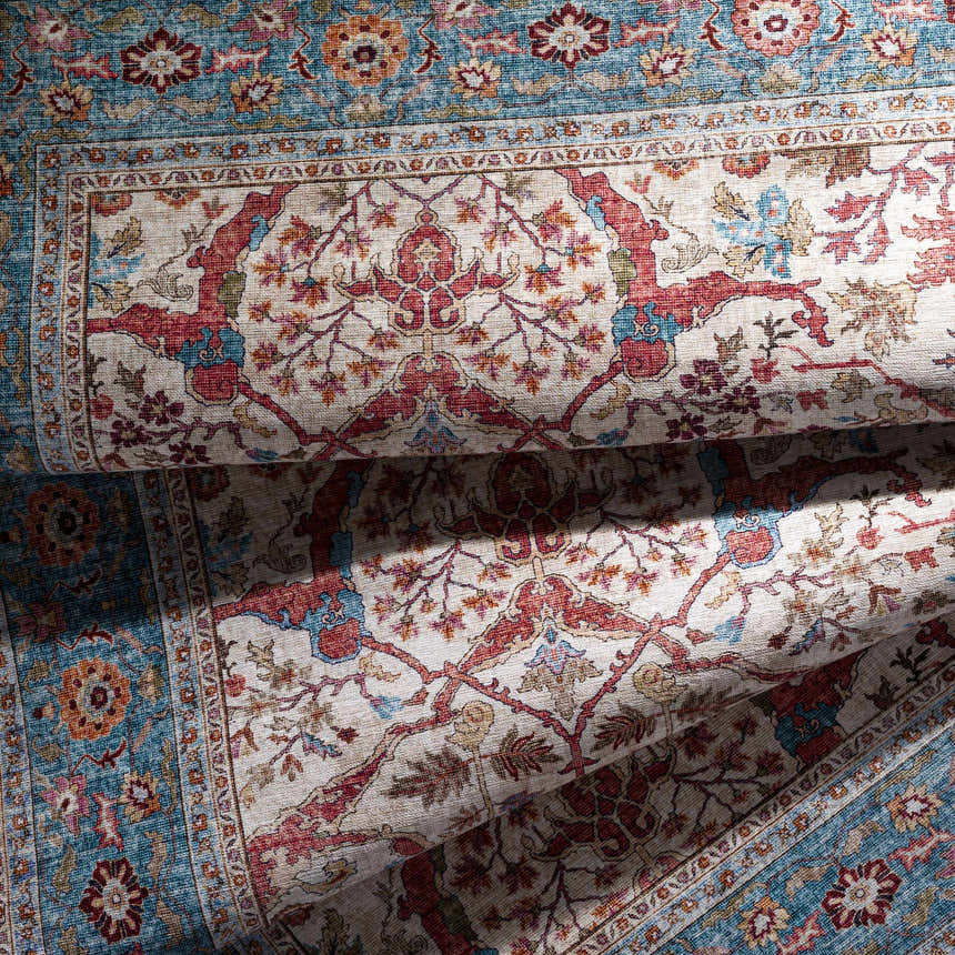 Close up of the Kislingbury Area Rug showing beige, red, and blue floral traditional pattern. Fold