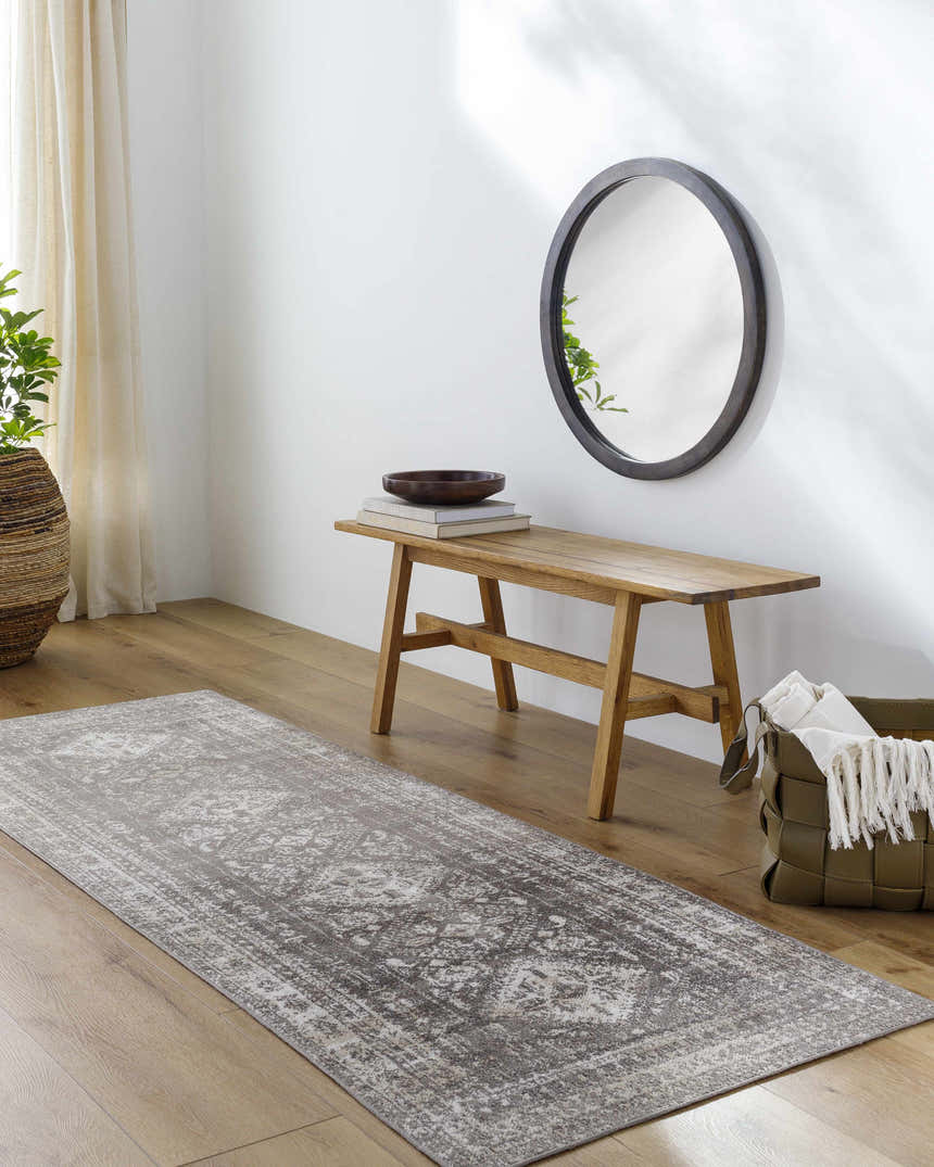 Hallway scene with Kingscourt Washable Area Rug runner in cream, gray, and brown. Bench, mirror, and plant complete the decor. Roomscene-Runner