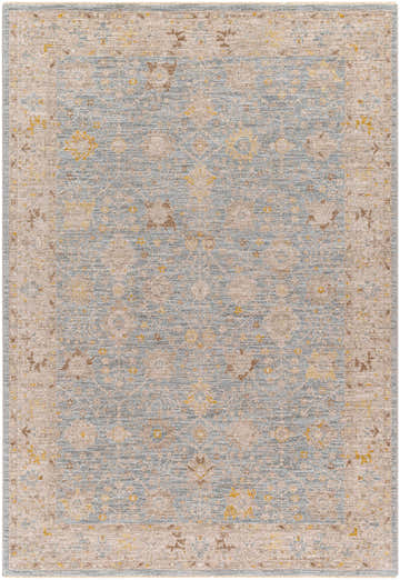 Close-up of the Kofi Thick Luxe Area Rug, showcasing its traditional design with amber, taupe, and light olive tones. Design-Rectangle-575
