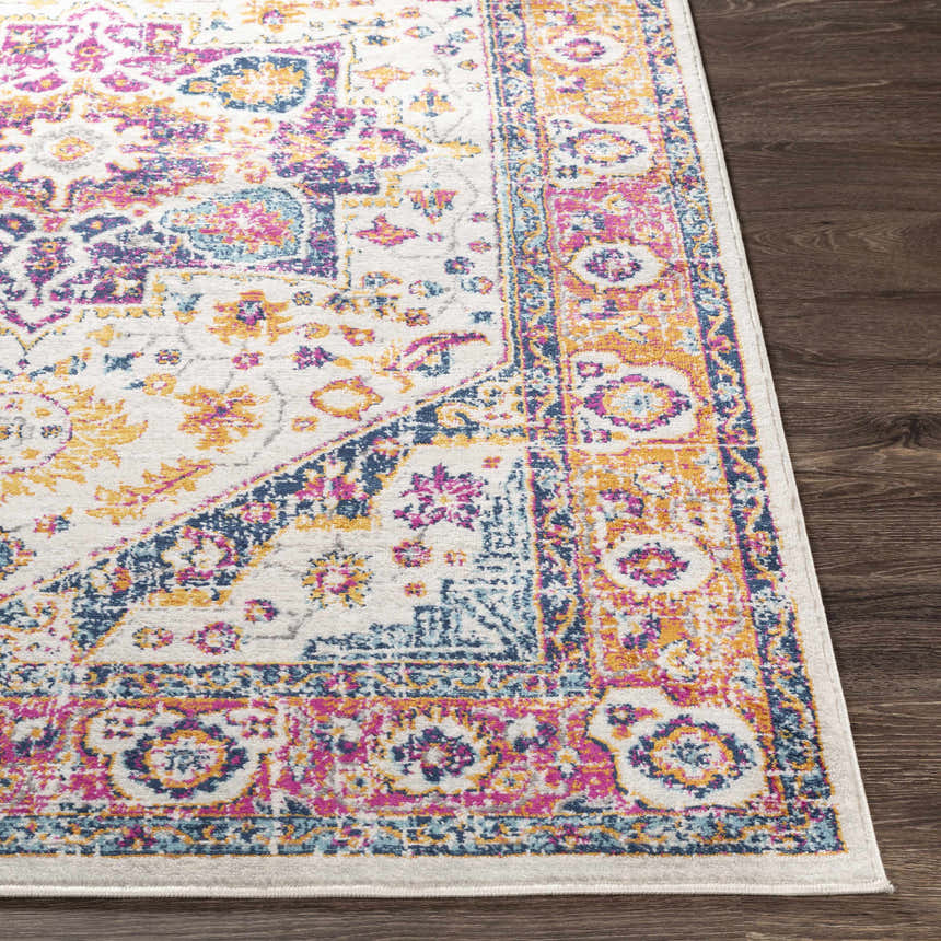 Close-up of the Kotlik Magenta & Cream Area Rug showing its bohemian design, floral patterns, and vibrant colors. Front