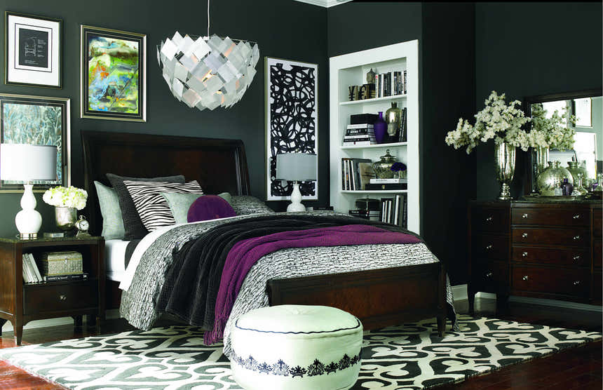 Bedroom scene with a black and cream Landa Area Rug, dark walls, wood furniture, and a modern aesthetic. Roomscene-Rectangle