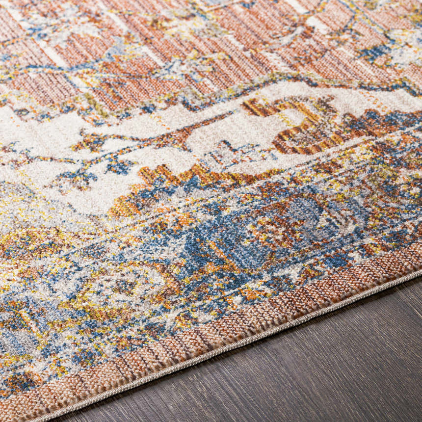Close up of Lappe Area Rug showing cream, blue, rust, and beige traditional pattern and texture. Texture
