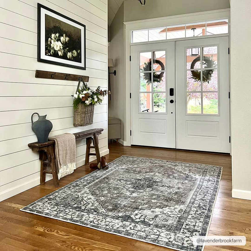 Farmhouse entryway with Athor Washable Rug in dark gray. Rustic bench, shiplap wall, and double doors create a welcoming scene. Roomscene-Rectangle