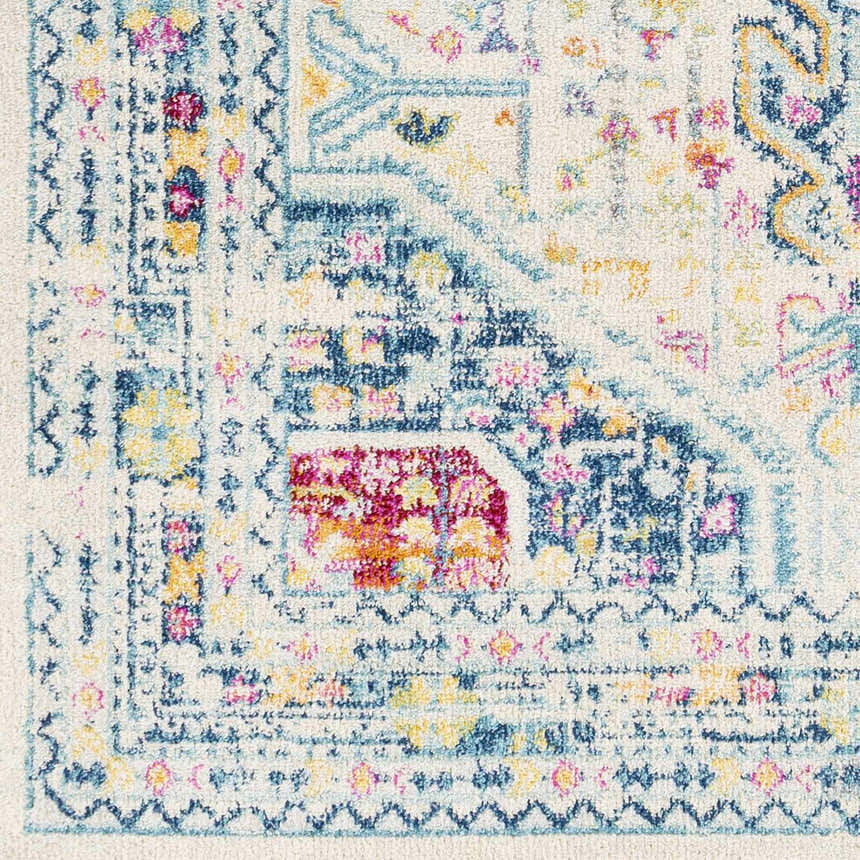 Close-up of the Leslie Area Rug, showcasing its aqua, burnt orange, and navy farmhouse design. Swatch