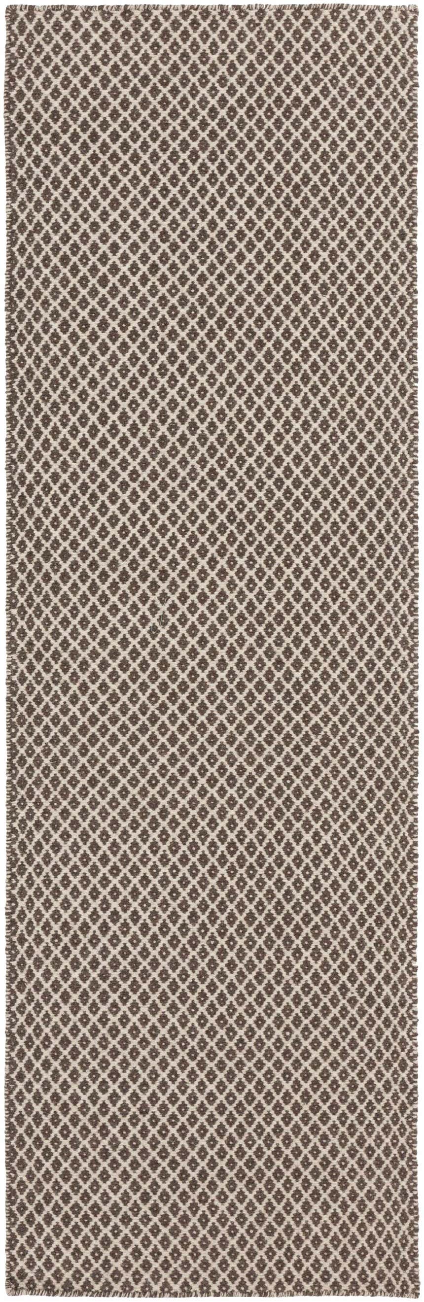 Close-up of the Lingo Brown Trellis Flatweave Rug. Hand-woven wool rug with a dark brown and oatmeal diamond trellis pattern. Design-Runner-268
