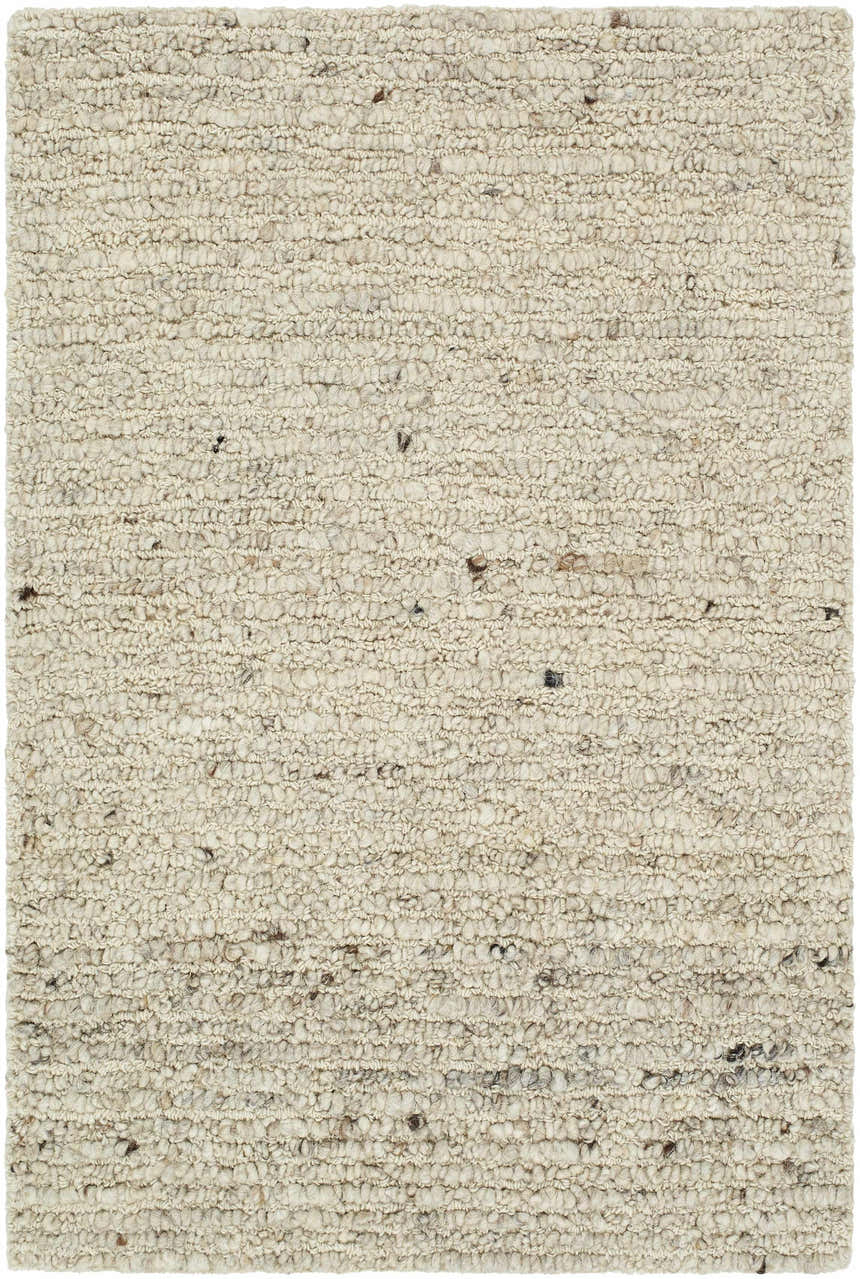 Close-up of the hand-tufted Winta Wool Area Rug. Ash, beige, and tan wool fibers create a nubby, textured farmhouse design. Design-Rectangle-23
