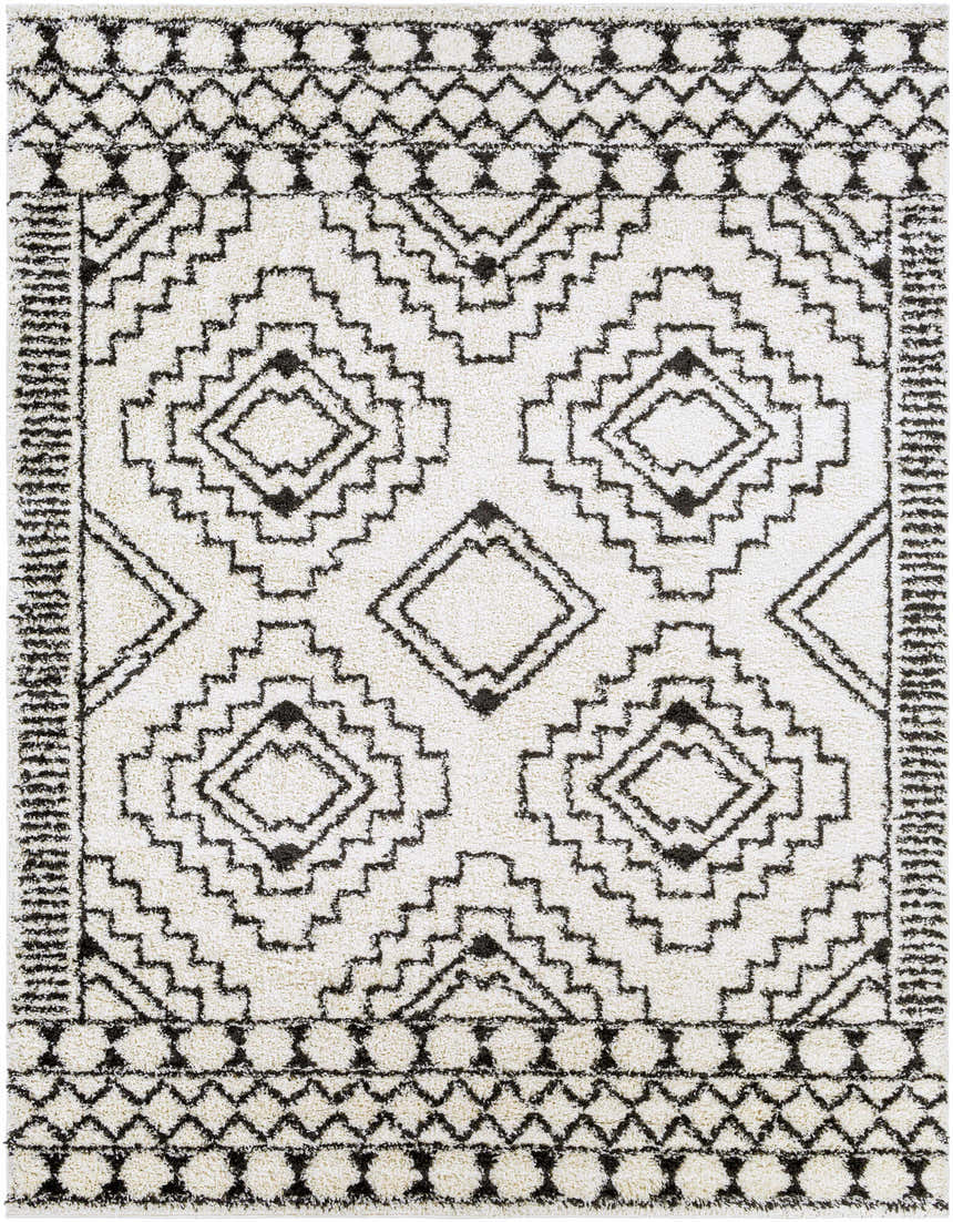 Close-up of the Lloydminster Area Rug. Cream shag rug with a black Moroccan-inspired geometric pattern. Design-Rectangle-71010