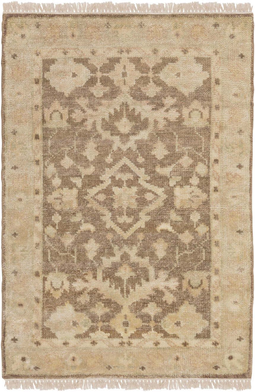 Close-up of the Lochmaben Premium Wool Rug. Hand-knotted rug in light brown and tan with a traditional floral pattern and fringe. Design-Rectangle-23