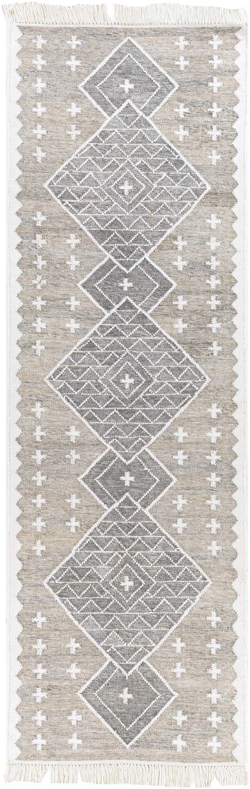 Close-up of the Lodwar Area Rug. Hand-woven rug with charcoal, cream, and gray diamond pattern and fringe. Design-Runner-268