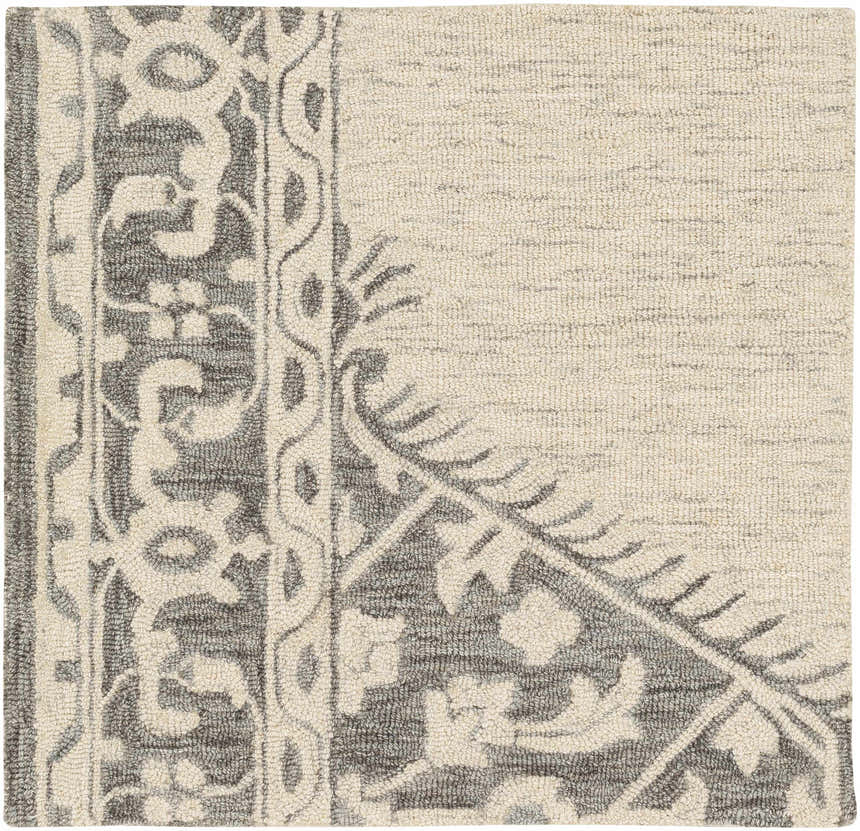 Close-up of the hand-tufted Longton Area Rug. Wool runner rug in charcoal, gray, and cream with a traditional floral pattern. Swatch
