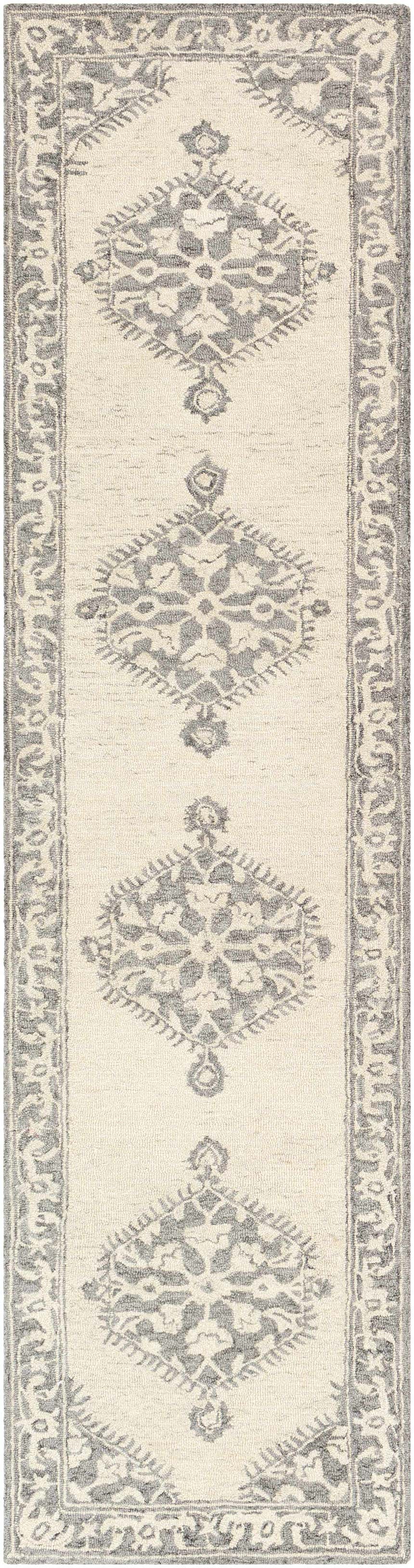 Close-up of the Longton Area Rug - Clearance. Hand-tufted wool runner rug in charcoal and gray with a traditional floral pattern. Design-Runner-2610