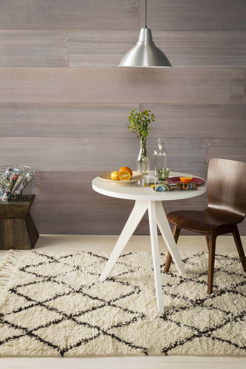 Farmhouse style room with a white table and Lothian Area Rug in charcoal and ivory. Roomscene-Rectangle