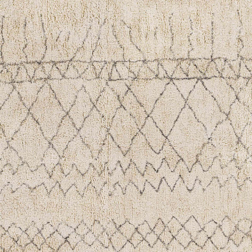 Close-up of the hand woven Luncarty Area Rug. Cream cotton rug with gray geometric diamond and zig zag pattern. Swatch