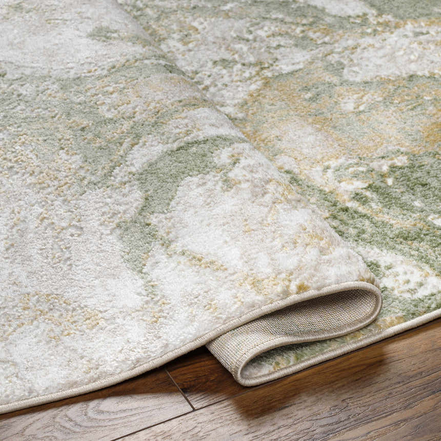Close-up of the Lively Marble Green Area Rug showing its cream, green, and gold abstract pattern and soft texture. Fold