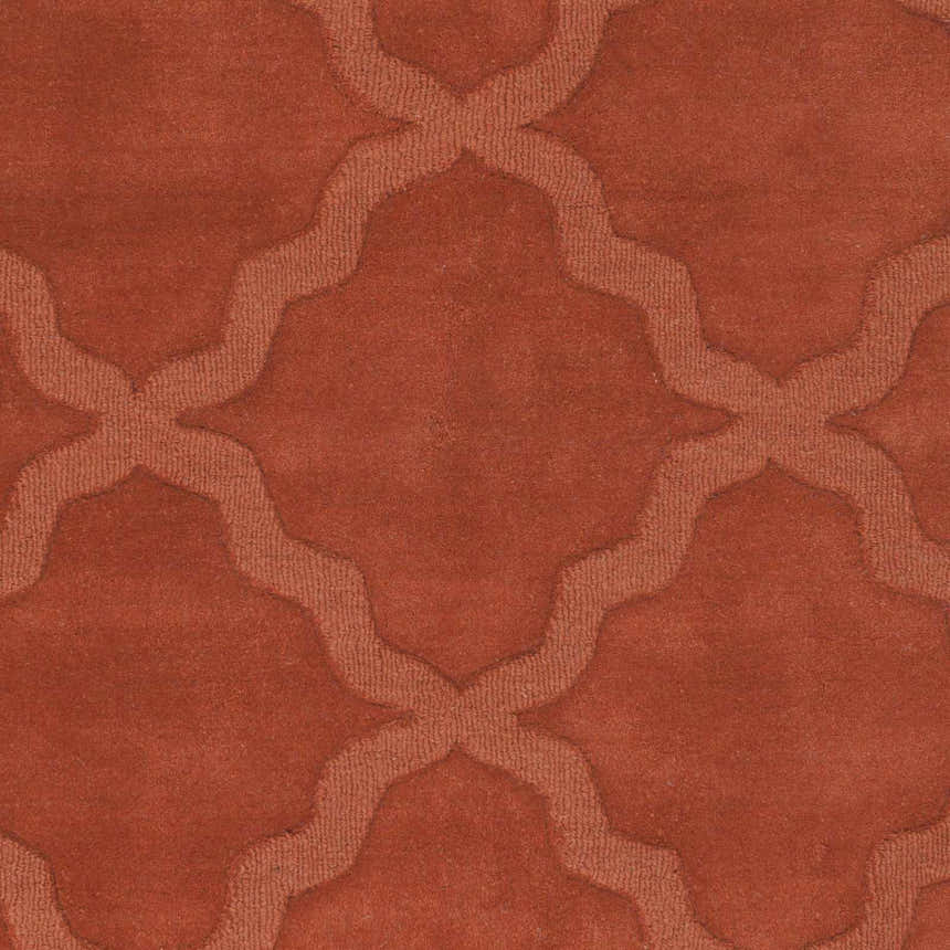 Close-up of the bright orange Lyoth Area Rug, a hand-loomed wool rug with a contemporary quatrefoil pattern. Swatch