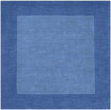 Close-up of the Macedon Blue Bordered Wool Rug. Solid design with navy blue border and lighter blue center. Hand-loomed texture. Design-Square-8