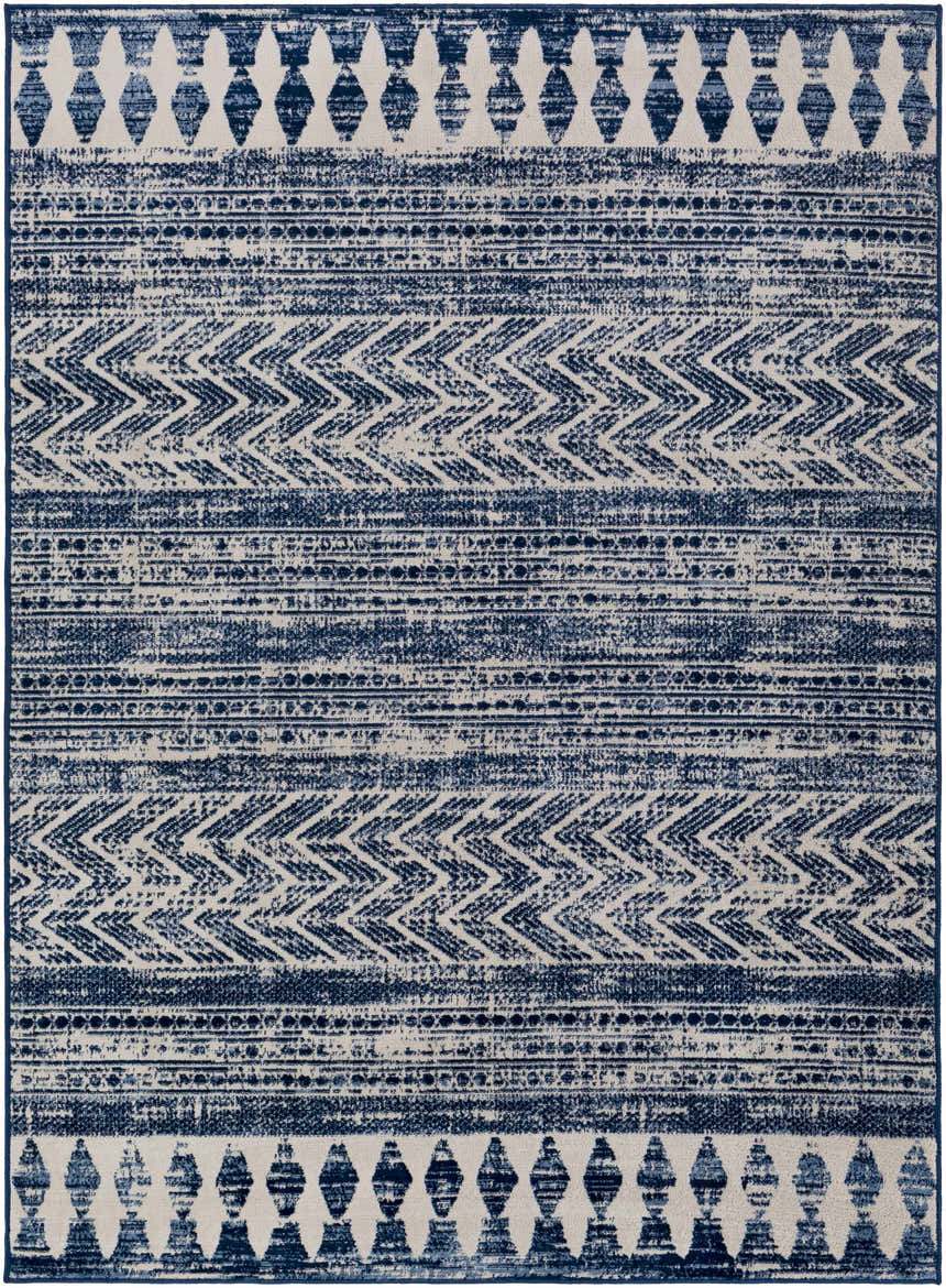 Close-up of the Mahinog Area Carpet - Clearance. Light blue, navy, and off-white bohemian rug with geometric and striped patterns. Design-Rectangle-46
