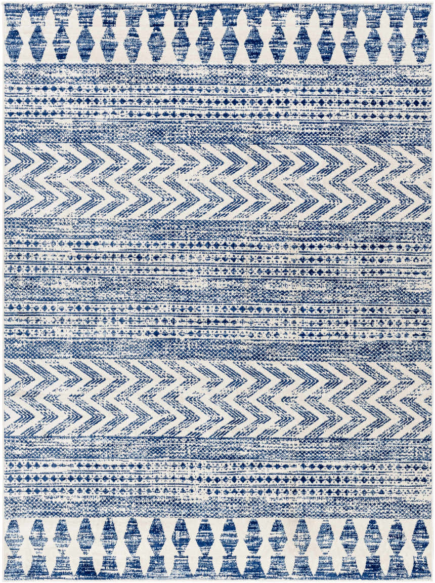 Close-up of the Mahinog Area Carpet. Light blue, navy, and off-white bohemian design with geometric and striped patterns. Design-Rectangle-679