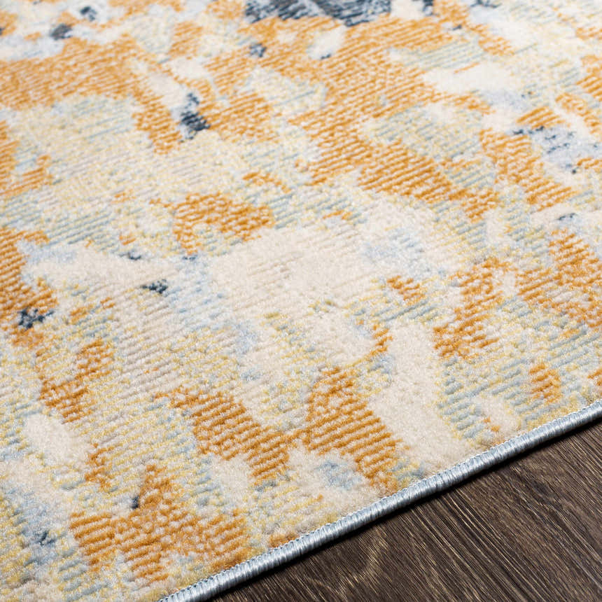 Close-up of the Mallow Area Carpet showing its contemporary design, beachhouse, camel, and dark beige colors. Texture