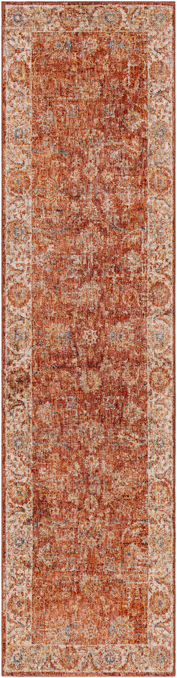 Close-up of the Maniwaki Area Rug. Features brick red, charcoal, dusty pink, and light beige colors with a traditional pattern. Design-Runner-2710