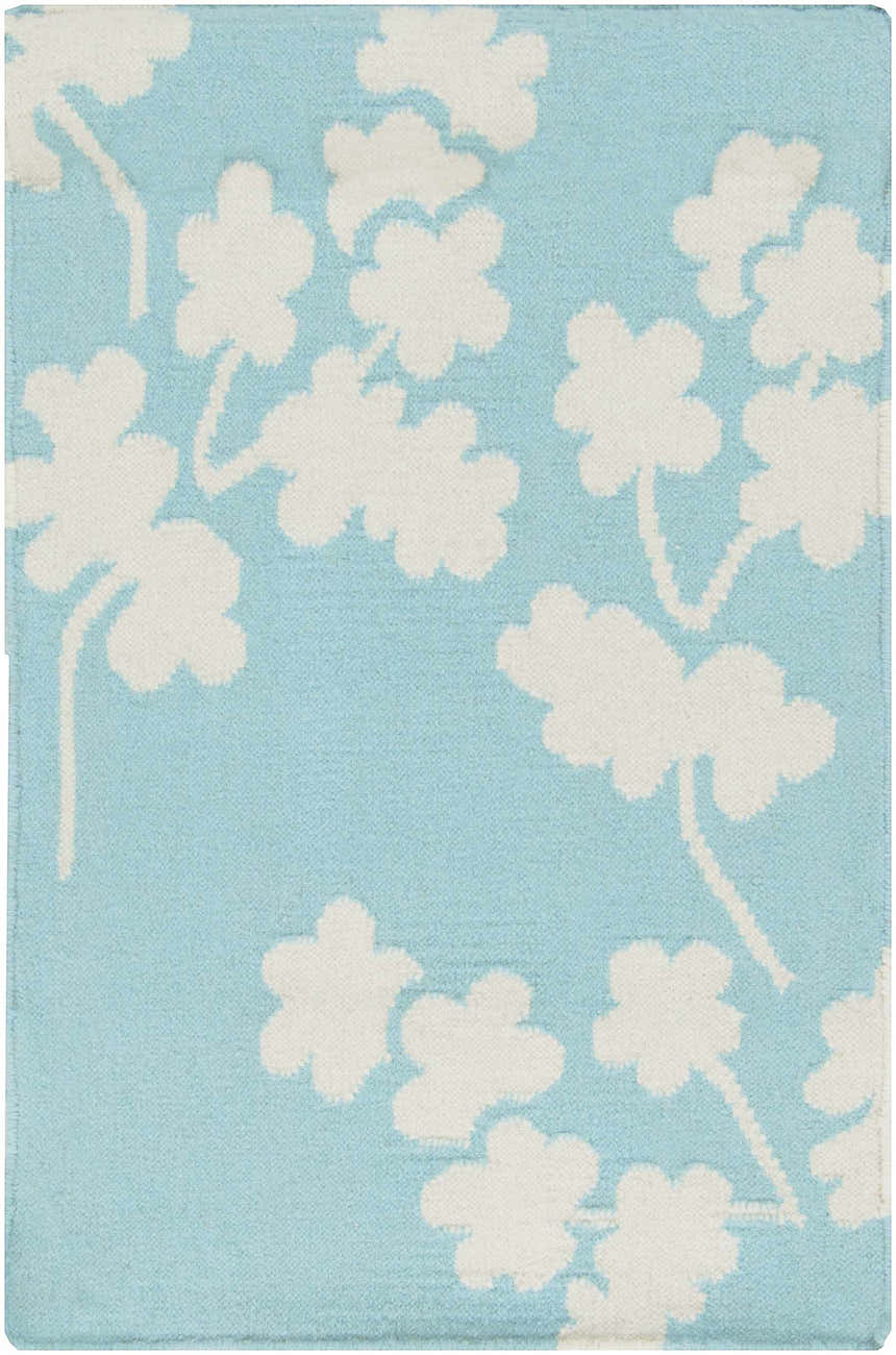 Close-up of the Matador Area Carpet. Aqua wool rug with a light beige floral pattern. Hand woven texture. Design-Rectangle-23