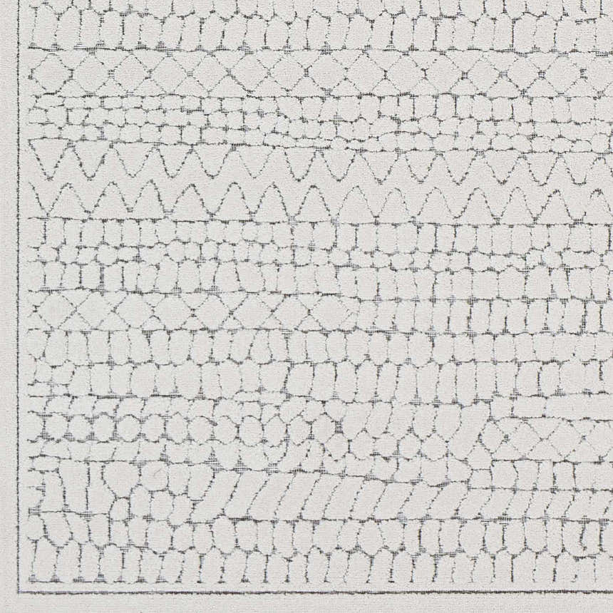 Close up of the Middlefield Outdoor Rug showing a charcoal and peach geometric pattern. Swatch
