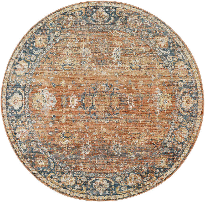 Close-up of round Mele Area Rug. Traditional floral pattern in burnt orange, dark brown, and blue. Farmhouse style. Design-Round-53