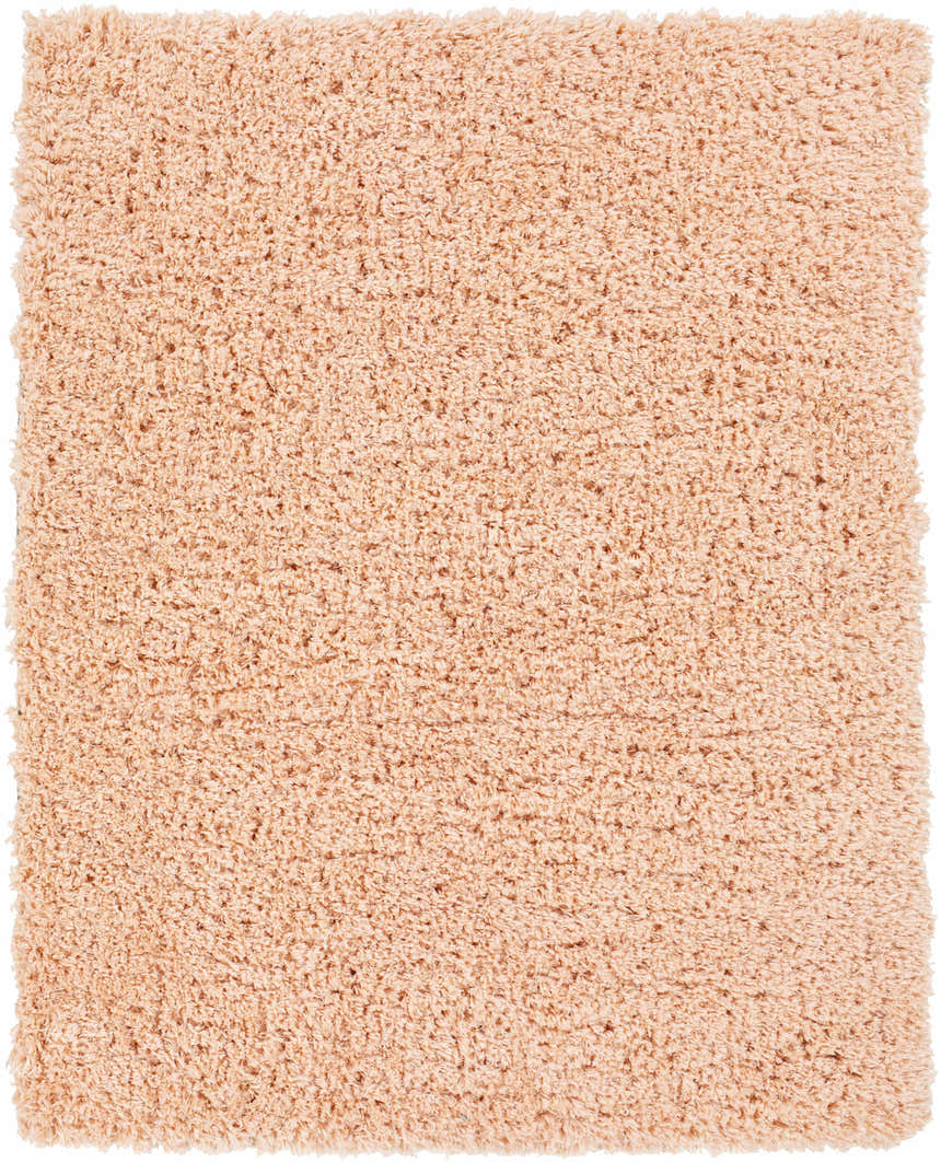 Close-up of the Siari Peach Shag Rug. Soft, plush texture and warm peach color. Perfect for a kids room or bathroom. Design-Rectangle-537