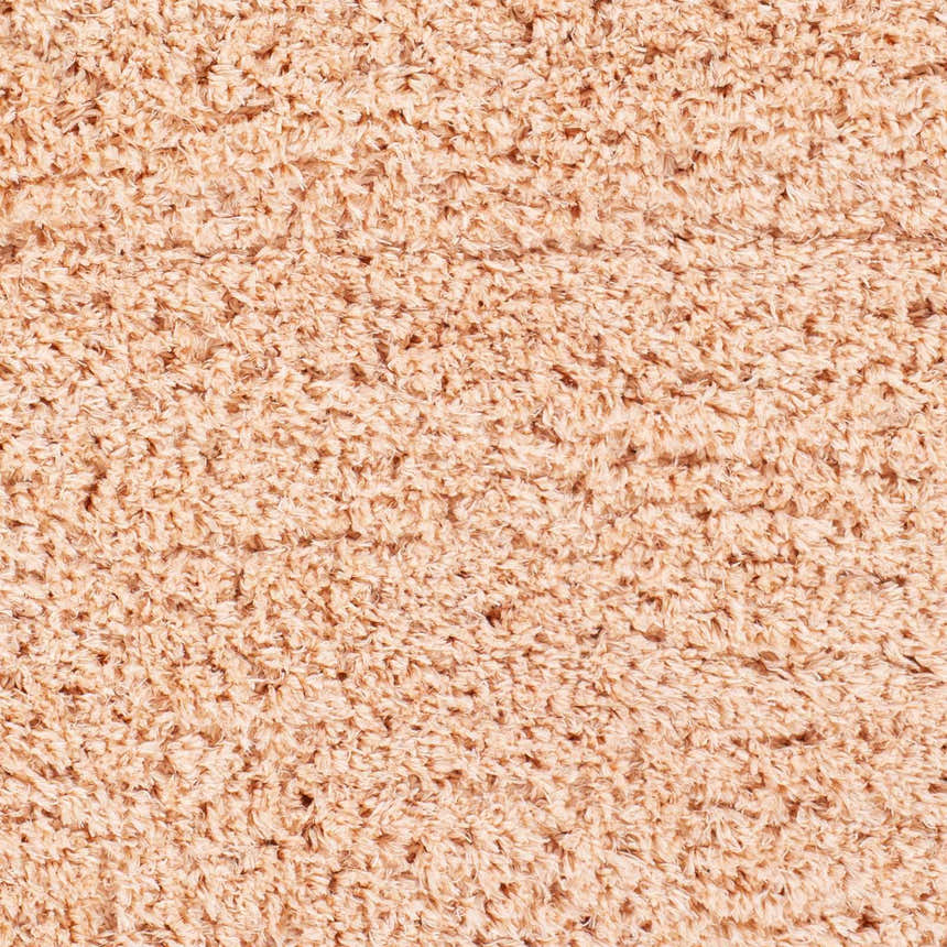 Close-up of the Siari Peach Shag Rug showing its soft, textured, high pile. Perfect for a kids room or bathroom. Swatch